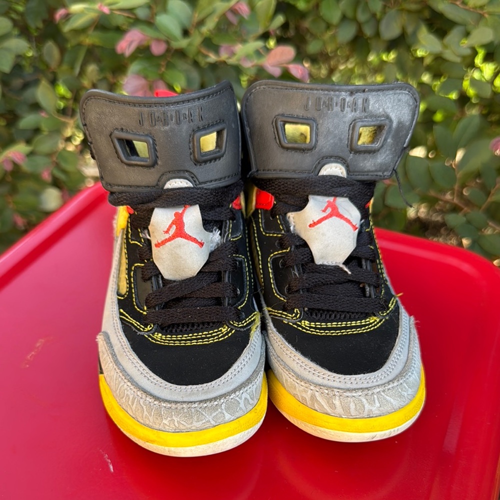Jordan 4 Black and Yellow High-Top Sneakers with Metallic Accents